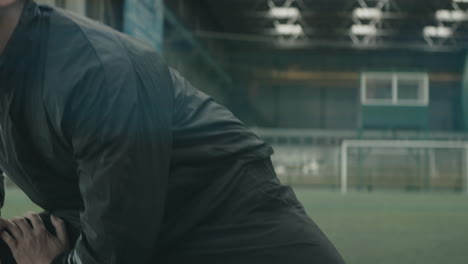 Football-Player-Preparing-Training-on-Indoor-Field